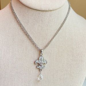 Cookie Lee fleur de lis rhinestone pave pendant necklace on silvertone chain